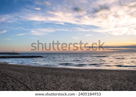 Mediterranean sea calm sunset seaside photo. Close up water with sand on the beach concept photography. Underwater rock. The view from the top, nautical background. High quality picture for wallpaper