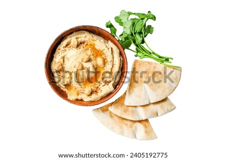 Hummus paste with pita bread, chickpea and parsley in a wooden bowl. Isolated on white background, top view Royalty-Free Stock Photo #2405192775