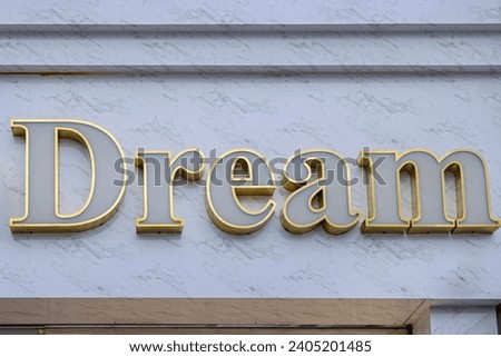White Letters With Gold Outline 3d Sign Dream at Marble Wall