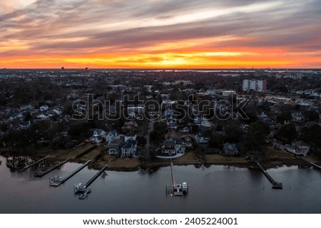 Aerial View of Homes on the Lafayette River in Norfolk Virginia At Sunset Looking Across the City Royalty-Free Stock Photo #2405224001