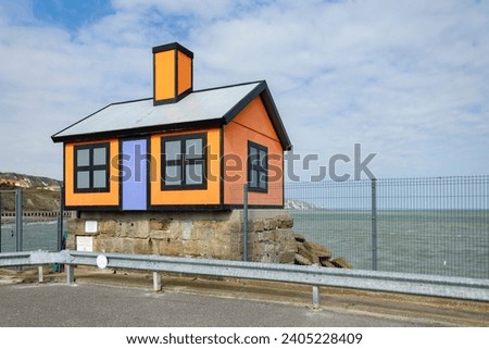 Folkestone, Kent ,uk August 1,  2023 orange and black  bungalow by Richard Woods on the harbour, in England Royalty-Free Stock Photo #2405228409
