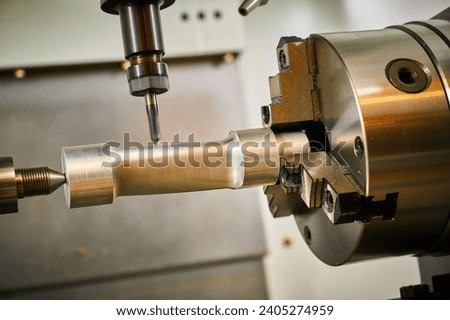 Milling machine tool operates with detail in workshop Royalty-Free Stock Photo #2405274959