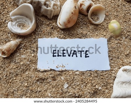 Elevate writing on beach sand background.