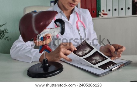 Ultrasound diagnosis of stomach and liver on abdominal cavity of in clinic. Ultrasound of liver and gallbladder cirrhosis Royalty-Free Stock Photo #2405286123