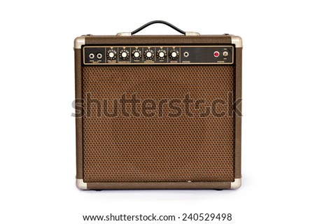 Brown electric guitar amplifier isolated on white background Royalty-Free Stock Photo #240529498