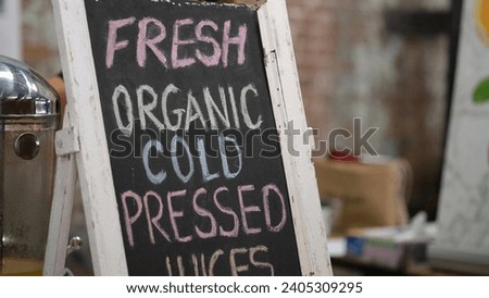 Fresh organic cold pressed juices sell at farmer market. Royalty-Free Stock Photo #2405309295