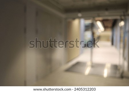 abstract blur and defocused in empty office building with glass window and copy space for background