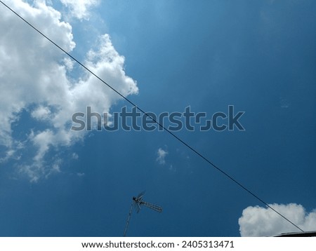 The photo of the blue sky covered with clouds is very beautiful. This photo is suitable for backgrounds and so on