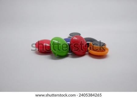 Magnetic pin with color, very useful to stick a note at refrigerator or a iron board.