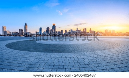 Round city square and Shanghai skyline with modern buildings at sunset