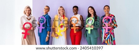 Group of beautiful confident women holding the femininity Venus symbol to celebrate women's day, concepts of women empowerment, women's right and diversity. Royalty-Free Stock Photo #2405410397