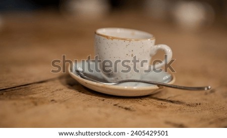 esspresso cups in detail on a wodden table Royalty-Free Stock Photo #2405429501