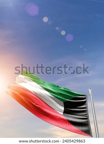 Kuwait national waving flag in vertical beautiful sky. Royalty-Free Stock Photo #2405429863