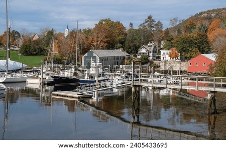 New England Harbor in Autumn:  Fall colors decorate the waterfront at a small coastal town in Maine.
