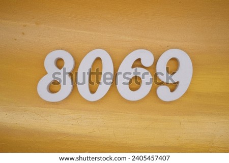The golden yellow painted wood panel for the background, number 8069, is made from white painted wood.
