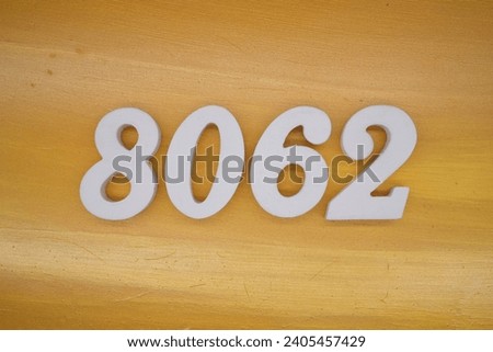 The golden yellow painted wood panel for the background, number 8062, is made from white painted wood.
