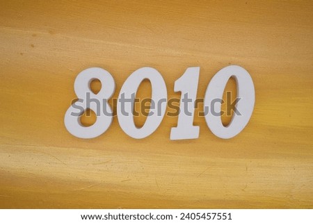 The golden yellow painted wood panel for the background, number 8010, is made from white painted wood.