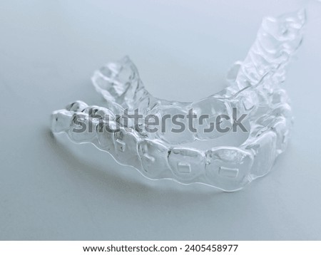 Invisible clear aligners for teeth straightening with lower and upper Royalty-Free Stock Photo #2405458977