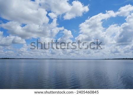 Clear sky and clear water surface Royalty-Free Stock Photo #2405460845