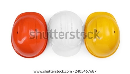 Hard hats isolated on white, top view. Safety equipment