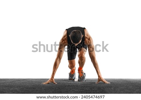Young athletic sportsman, professional runner trains running from low start against white studio background. Concept of sport, active lifestyle, action, victory, workout. Copy space. Ad Royalty-Free Stock Photo #2405474697