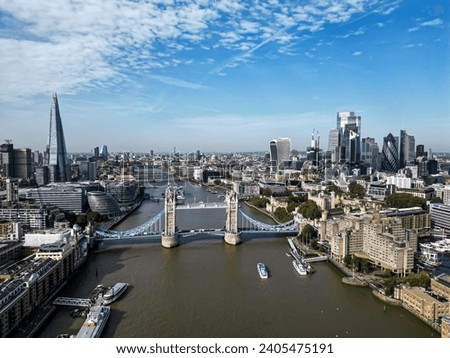 Iconic Tower Bridge Aerial drone View of Tower Bridge, Skyline. United Kingdom, UK.  Skyline of London business center the River Thames Royalty-Free Stock Photo #2405475191