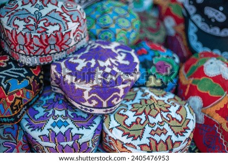 traditional Uzbek caps in the shop, southern Uzbekistan, history of uzbekistan, historical photography, tourism. Royalty-Free Stock Photo #2405476953