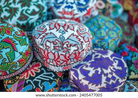 traditional Uzbek caps in the shop, southern Uzbekistan, history of uzbekistan, historical photography, tourism. Royalty-Free Stock Photo #2405477005