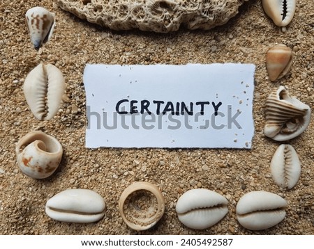 Certainty writing on beach sand background.
