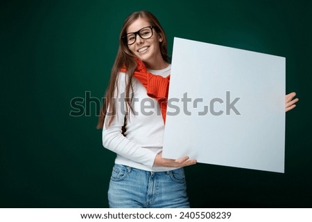 European young woman in white turtleneck showing board mockup