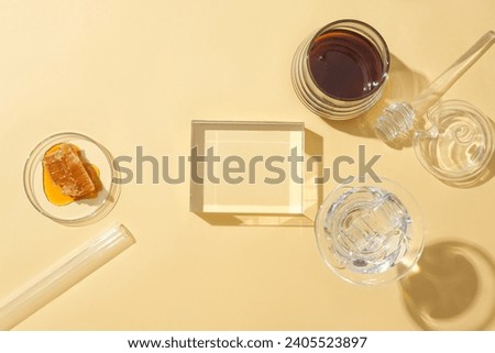 On a pastel background, an empty glass podium sets the stage for product display, featuring stored honey in glassware. Honey accelerates skin cell recovery, addressing a key factor in eczema.