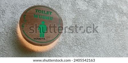 green toilet pointer made of teak wood