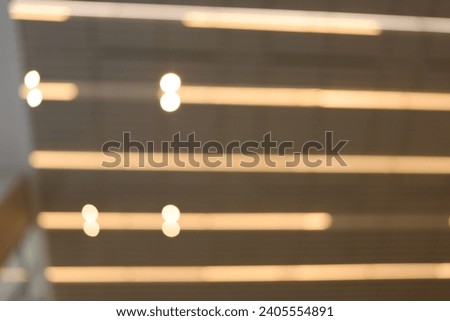 Blur focus of The hanging rounded ceiling mounted light fixtures with modern LED light bulb,Architecture and interior design round lights on ceiling. Royalty-Free Stock Photo #2405554891