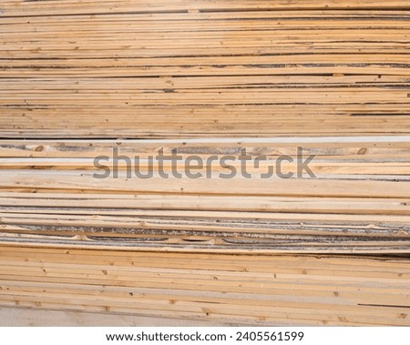 Boards at the sawmill, a huge number of wooden parts on the market for the sale of wooden blanks.