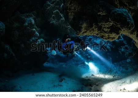 Tek diver with a rebreather visiting Zabargad cave in the Red Sea Egypt Royalty-Free Stock Photo #2405565249