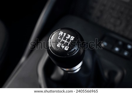 automatic transmission shift selector in the car interior. Closeup a manual shift of modern car gear shifter. 4x4 gear shift	 Royalty-Free Stock Photo #2405566965