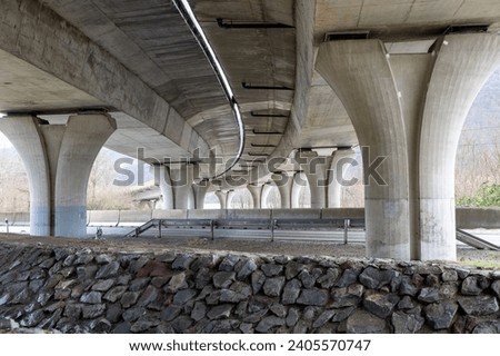 Vehicle overpass on concrete supports. Overbridge or Flyover built on concrete pylons.
