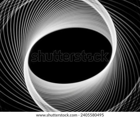 PHOTO : Light painting photography of white spirographs on black background
