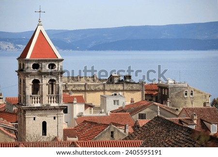 View from Mirabela Fortress (Peovica) on the 18th century bell tower of the Parish Church of St. Michael in Omiš (Dalmatia, Croatia). Royalty-Free Stock Photo #2405595191
