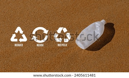 Reduce, reuse, recycle symbol on Plastic water bottles are left on the beach as waste polluting nature, ecological metaphor for ecological waste management and sustainable and economical lifestyle. Royalty-Free Stock Photo #2405611481
