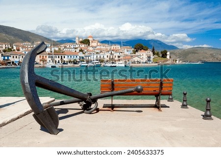 View of Galaksidi town, a picturesque place with rich maritime history as the iron anchor in the background testifies, monument to the town's seamen