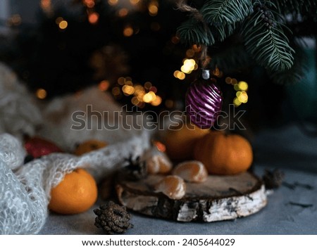 New Year's, festive background with tangerines, Christmas tree and Christmas tree decorations
