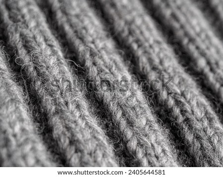 coarse knitted wool fabric, fabric background, close-up macro