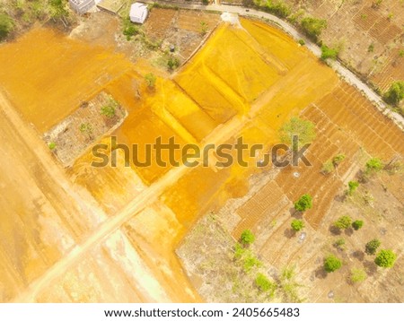 Industrial Photography. Aerial Landscapes. Dredged hills, reclamation land area prepare for housing construction in rural area. Aerial Shot from a flying drone. Bandung - Indonesia, Asia