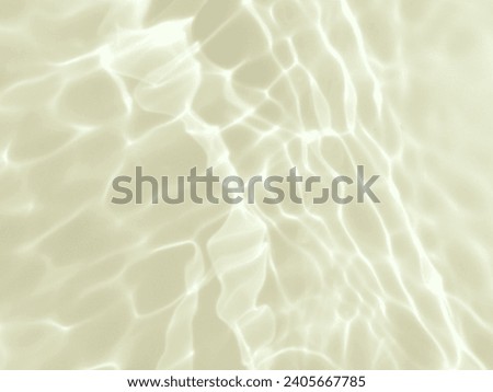 Closeup​ blur​ abstract​ of​ surface​ blue​ water. Abstract​ of​ surface​ blue​ water​ reflected​ with​ sunlight​ for​ background.Top​ view​ of blue​.
