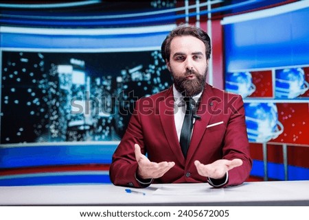 News presenter on late talk show discussing about current events live on tv broadcast, transmitting information for global television network. Man presenter reading latest headlines.