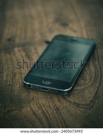 an outdated but still attractive black smartphone
