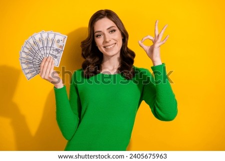 Photo of attractive satisfied rich woman wear trendy green clothes showing okey sign nice bank offer isolated on yellow color background