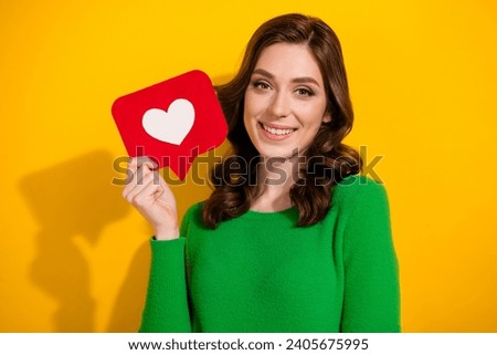 Photo of lovely adorable cute woman showing social media instagram facebook like isolated on yellow color background Royalty-Free Stock Photo #2405675995
