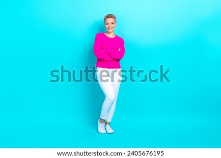 Full size photo of adorable lovely woman dressed pink sweater white trousers holding arms crossed isolated on teal color background